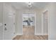 Bright entryway with hardwood floors and views into the updated kitchen at 701 Wilsons Mills Rd, Smithfield, NC 27577