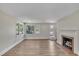 Living room with fireplace and view to yard at 701 Wilsons Mills Rd, Smithfield, NC 27577