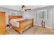 Main bedroom with wood sleigh bed and neutral color scheme at 8 Harrigan Ct, Durham, NC 27705