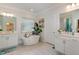 Elegant bathroom with soaking tub, double vanity, and separate shower at 8101 Fergus Ct, Wake Forest, NC 27587