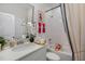 Clean bathroom with a tub shower combo and double vanity at 8101 Fergus Ct, Wake Forest, NC 27587