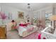 Charming bedroom with a light-colored bed and pink accents at 8101 Fergus Ct, Wake Forest, NC 27587