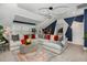 Spacious bonus room featuring a sectional sofa and stylish lighting at 8101 Fergus Ct, Wake Forest, NC 27587
