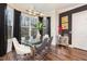Bright breakfast nook boasts a glass table, modern chairs, and large windows at 8101 Fergus Ct, Wake Forest, NC 27587