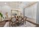 Elegant dining room features a large wooden table, chandelier, and stylish wall decor at 8101 Fergus Ct, Wake Forest, NC 27587
