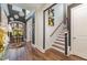Two-story entryway with staircase and dark hardwood floors at 8101 Fergus Ct, Wake Forest, NC 27587