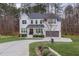 Two-story white brick home with circular driveway at 8101 Fergus Ct, Wake Forest, NC 27587