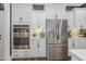 Stainless steel appliances and white cabinetry highlight this kitchen at 8101 Fergus Ct, Wake Forest, NC 27587