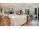Open concept kitchen with white island, farm sink, and stainless steel appliances at 8101 Fergus Ct, Wake Forest, NC 27587