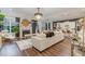 Open living room with fireplace, built-ins, and hardwood floors at 8101 Fergus Ct, Wake Forest, NC 27587