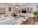 Open concept living area with modern chandelier and furniture at 8101 Fergus Ct, Wake Forest, NC 27587