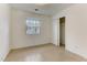 Small bedroom with tiled floors and closet at 830 E Lenoir St, Raleigh, NC 27601