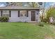 Charming gray duplex unit with a dark door and a grassy yard at 830 E Lenoir St, Raleigh, NC 27601