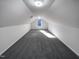 Large bonus room with sloped ceilings and window at 1004 Cabin Hill Way, Garner, NC 27529