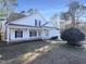 Two story home with white siding and landscaping at 1004 Cabin Hill Way, Garner, NC 27529
