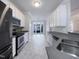 Modern kitchen with stainless steel appliances and breakfast area at 1004 Cabin Hill Way, Garner, NC 27529