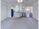 Open living room with hardwood floors and kitchen view at 1004 Cabin Hill Way, Garner, NC 27529