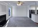 Spacious living room with grey carpet and fireplace at 1004 Cabin Hill Way, Garner, NC 27529