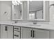 Bathroom with double vanity, white cabinets, and black hardware at 104 Spruce Hollow Cir, Spring Lake, NC 28390