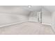 Bright bedroom featuring carpet flooring and an open door to hallway at 104 Spruce Hollow Cir, Spring Lake, NC 28390