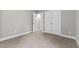 Simple bedroom with neutral walls, carpet flooring, and a window at 104 Spruce Hollow Cir, Spring Lake, NC 28390
