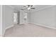 Spacious bedroom with ceiling fan, carpet flooring, and walk-in closet at 104 Spruce Hollow Cir, Spring Lake, NC 28390