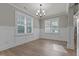 Bright dining room with wainscoting and hardwood floors at 104 Spruce Hollow Cir, Spring Lake, NC 28390