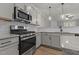 Modern kitchen with stainless steel appliances and granite countertops at 104 Spruce Hollow Cir, Spring Lake, NC 28390