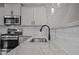 Kitchen detail with granite countertop and stainless steel sink at 104 Spruce Hollow Cir, Spring Lake, NC 28390