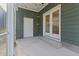 Relaxing screened porch with string lights and access to backyard at 104 Spruce Hollow Cir, Spring Lake, NC 28390