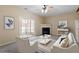 Inviting living room features a fireplace and sliding glass doors to outdoor space at 11215 Lofty Heights Pl, Raleigh, NC 27614
