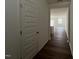 Inviting hallway featuring wood flooring, a neutral color palette, and an open concept design at 128 Parker Ln, Mebane, NC 27302