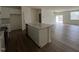 Modern kitchen boasts an island, sleek cabinetry, and stainless steel appliances at 128 Parker Ln, Mebane, NC 27302