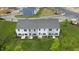 Aerial view of townhomes and surrounding green space at 14 Virgo Dr, Angier, NC 27501