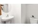 Small half bathroom with pedestal sink and toilet at 14 Virgo Dr, Angier, NC 27501