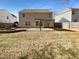 Spacious backyard with a pergola and fire pit at 1611 Copper Cir, Mebane, NC 27302