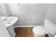 Simple bathroom with pedestal sink and wood-look floors at 1611 Copper Cir, Mebane, NC 27302