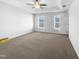 Spacious bedroom with ceiling fan and neutral carpeting at 1611 Copper Cir, Mebane, NC 27302