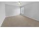Simple bedroom with carpeted floors and a window with blinds at 1611 Copper Cir, Mebane, NC 27302