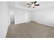 Bright bedroom with ceiling fan and neutral carpet at 1611 Copper Cir, Mebane, NC 27302