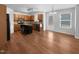 Kitchen with island, stainless steel appliances, and wood flooring at 1611 Copper Cir, Mebane, NC 27302