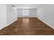 Spacious living room featuring hardwood floors and neutral walls at 1611 Copper Cir, Mebane, NC 27302