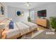 Virtually staged main bedroom with a bed, dresser, and plenty of space at 1611 Copper Cir, Mebane, NC 27302