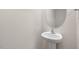 Simple pedestal sink and oval mirror in a small, clean bathroom at 18 Virgo Dr, Angier, NC 27501