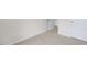 Carpeted bedroom with doors to other rooms at 18 Virgo Dr, Angier, NC 27501