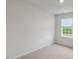 Bright bedroom featuring a window and carpet at 18 Virgo Dr, Angier, NC 27501