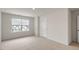 Bright bedroom with carpeted floor, large window, and ample closet space at 18 Virgo Dr, Angier, NC 27501