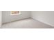 Simple bedroom with carpeted floor and window at 18 Virgo Dr, Angier, NC 27501