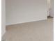 Empty carpeted bedroom with an open door to another room at 18 Virgo Dr, Angier, NC 27501