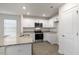 Modern kitchen with granite countertops and stainless steel appliances at 18 Virgo Dr, Angier, NC 27501